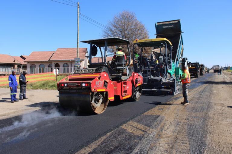 Full asphalt paving train operations - paver, rollers and support vehicles on N1 bypass - Abpy Group Pty Ltd